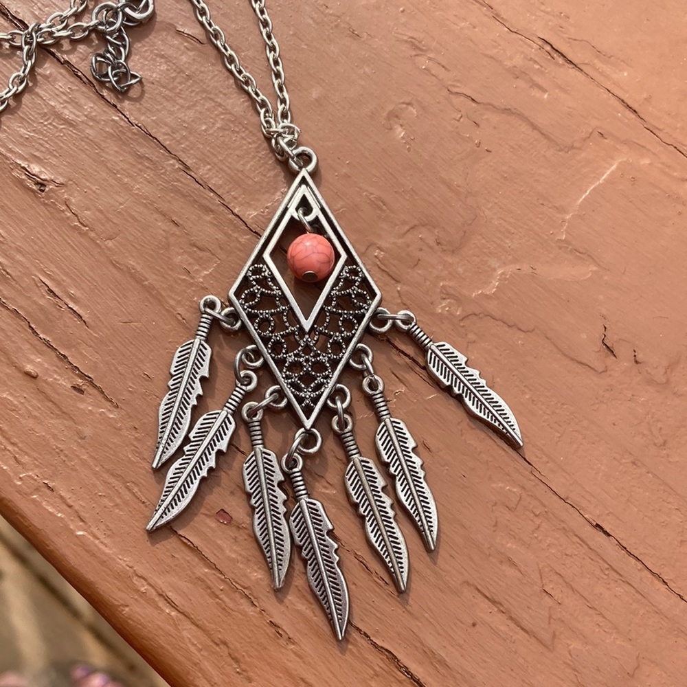 Silver feather pendant necklace